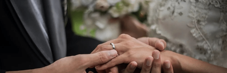 Couple exchanging rings at a wedding