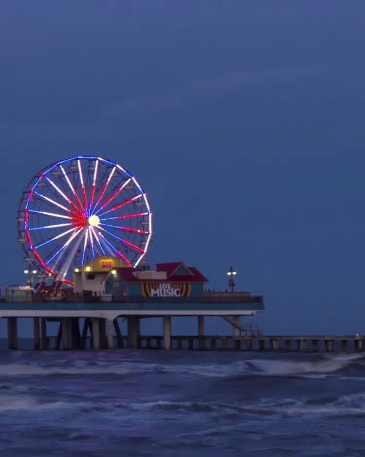 Galveston Island Historic Pleasure Pier at dusk with its Ferris wheel